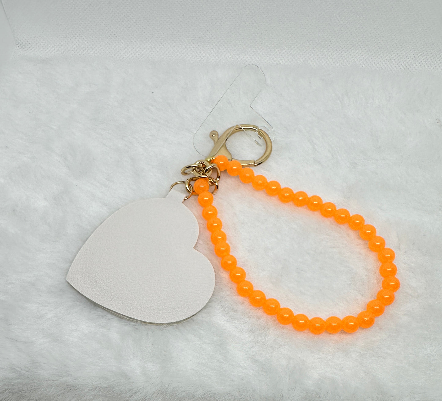 Sleutel/telefoon hanger Glow in the dark Oranje